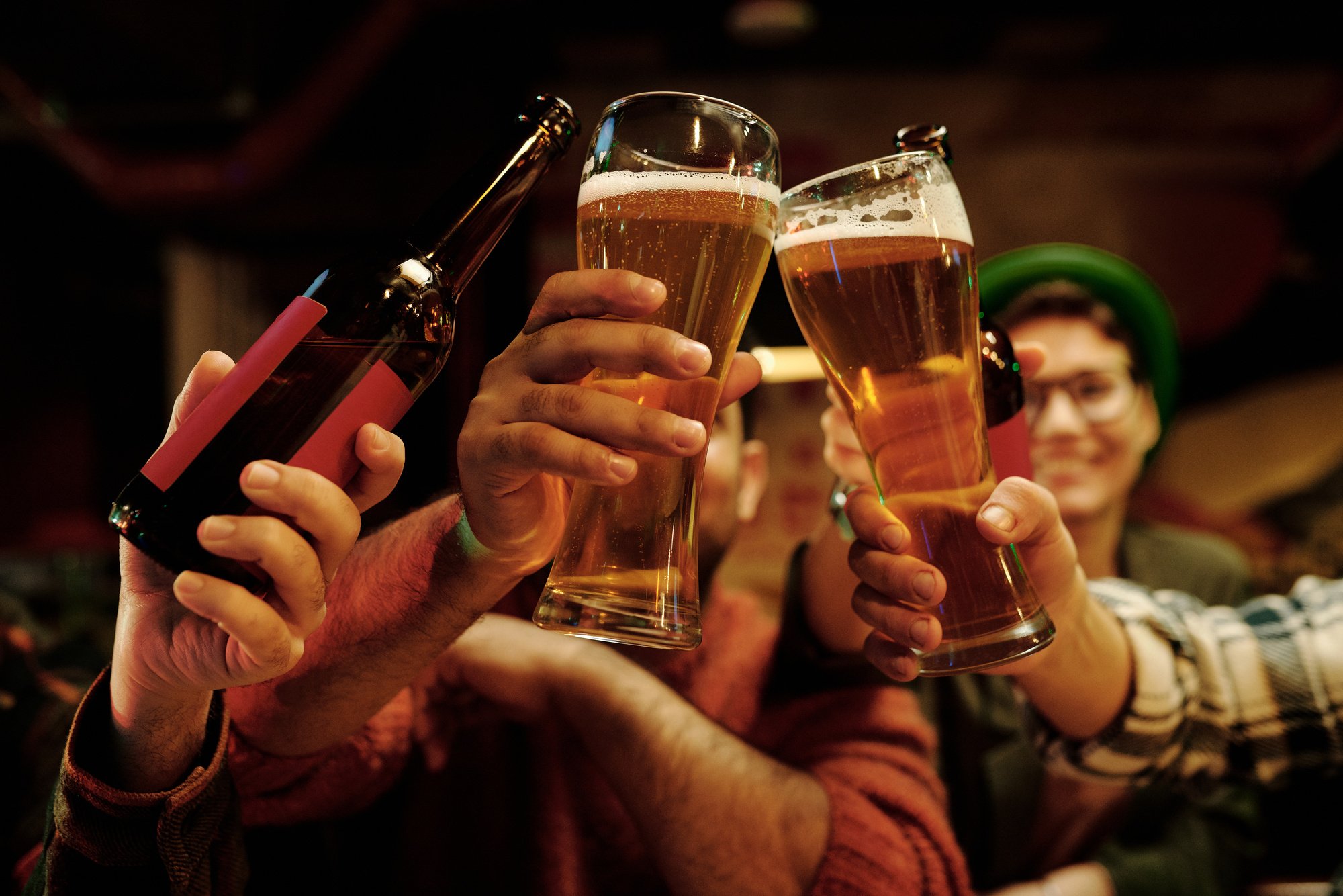 People Tossing Their Drinks in Celebration  of the Holiday