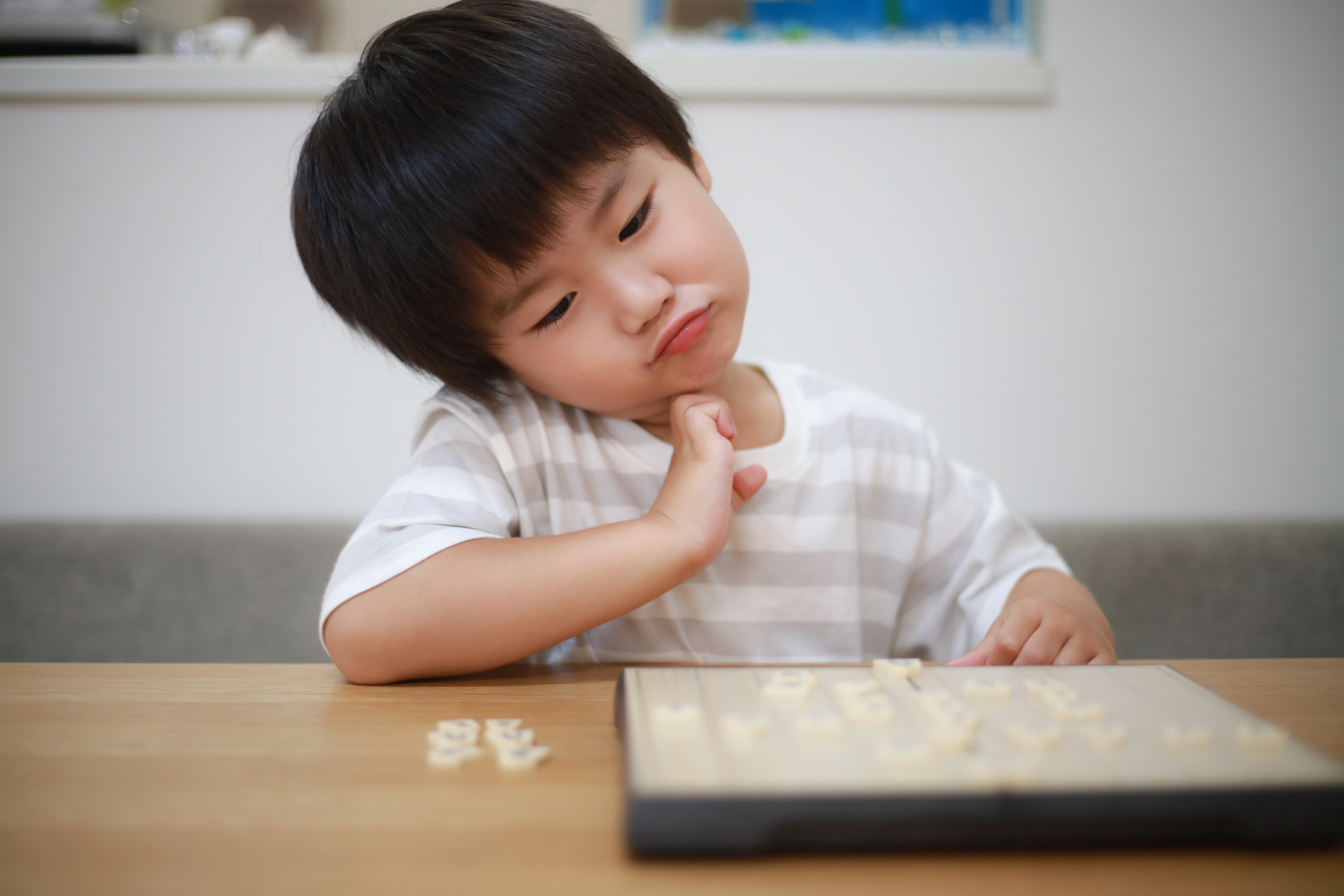 Boy pointing to shogi